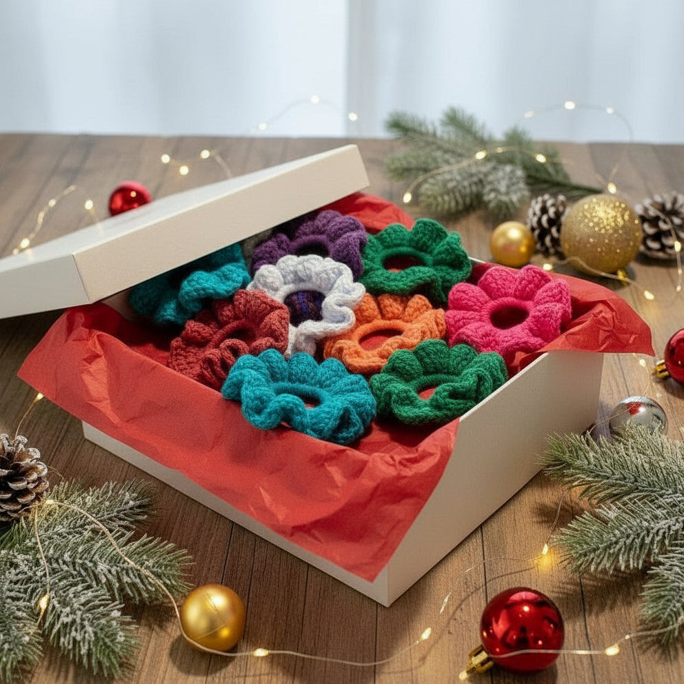 Set of colorful crocheted scrunchies on a light gray background